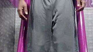 Black Brunette Uses Fitness Machine for Intense Gym Workout