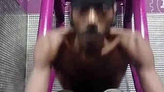 Black Brunette Uses Fitness Machine for Intense Gym Workout
