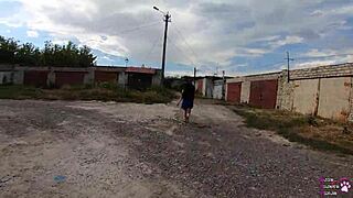 Horny student sucks big cock behind garages.