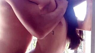 Passionate sex on the balcony draws whistles from workers watching