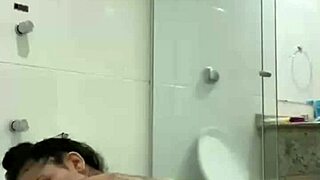 Is Bia masturbating with the shower jet?