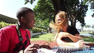 College professor engaging in oral activity with black partner