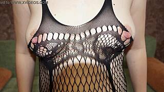 the pregnant milf poses in tights showing her booty and pussy