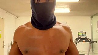 Black bodybuilder works out neck and shoulders outdoors in California for ladies.