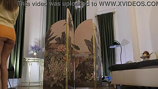 Beautiful brunette babe tries on lingerie and mini skirts backstage for a haul day