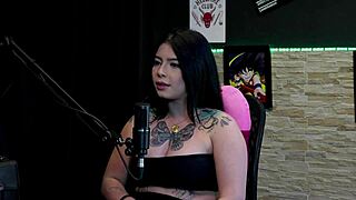A tattooed brunette reveals her big tits during truth or dare, then shares stories about her friend's dick and sex experiences.