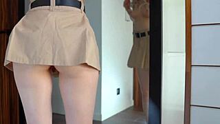 hot blonde gets impaled on black dildo on mirror while tries on sexy skirts