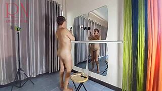 Naked nudist hairdresser cuts her own hair