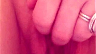 close-up view of a pierced shaved pussy peeing in amateur homemade compilation