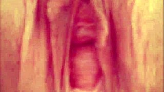 close-up view of a pierced shaved pussy peeing in amateur homemade compilation