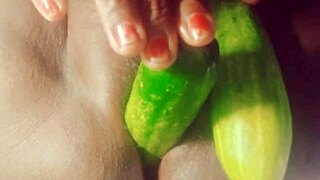 Indian village girl explores her desires with a cucumber in a suggestive homemade scene.