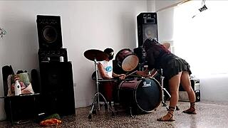 Drum beats make her strip teasingly, shaking huge ass seductively for viewers