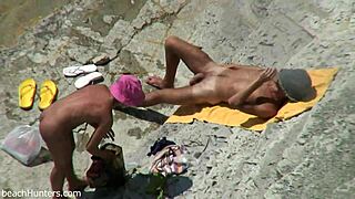 Beach Couple's Steamy Encounter on Sand